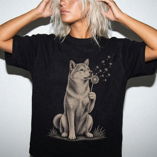 Model wearing a Black Comfort Colors® T-shirt showing Shiba Inu portrait with drifting dandelion seeds