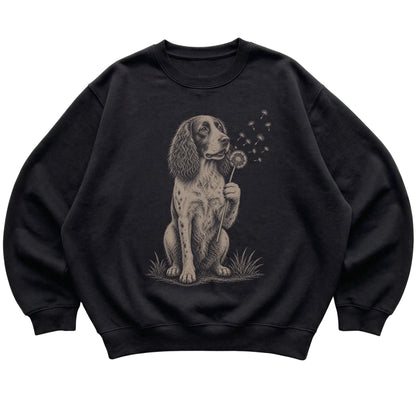 Black crewneck sweatshirt featuring Dandelion Springer Spaniel, laid-flat presentation