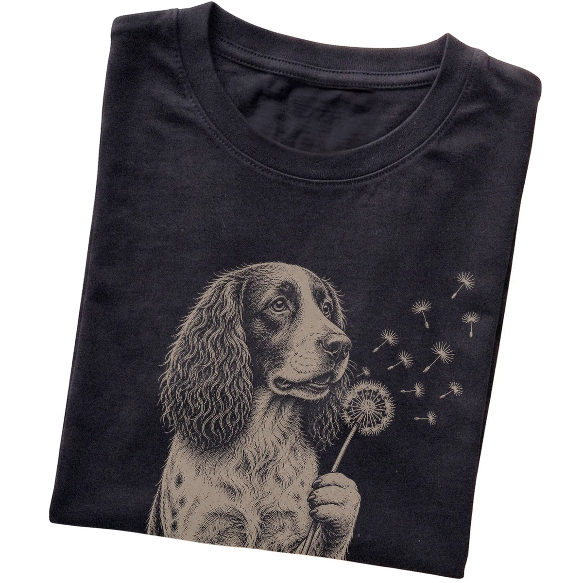 Black T-shirt featuring Dandelion Springer Spaniel, folded presentation