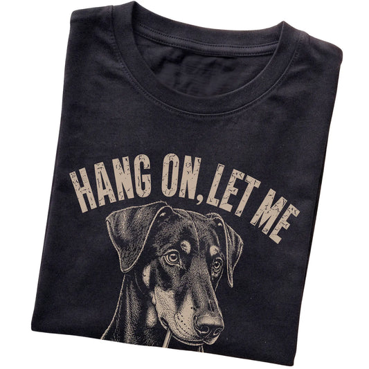 Black T-shirt featuring Overthinking Doberman, folded presentation