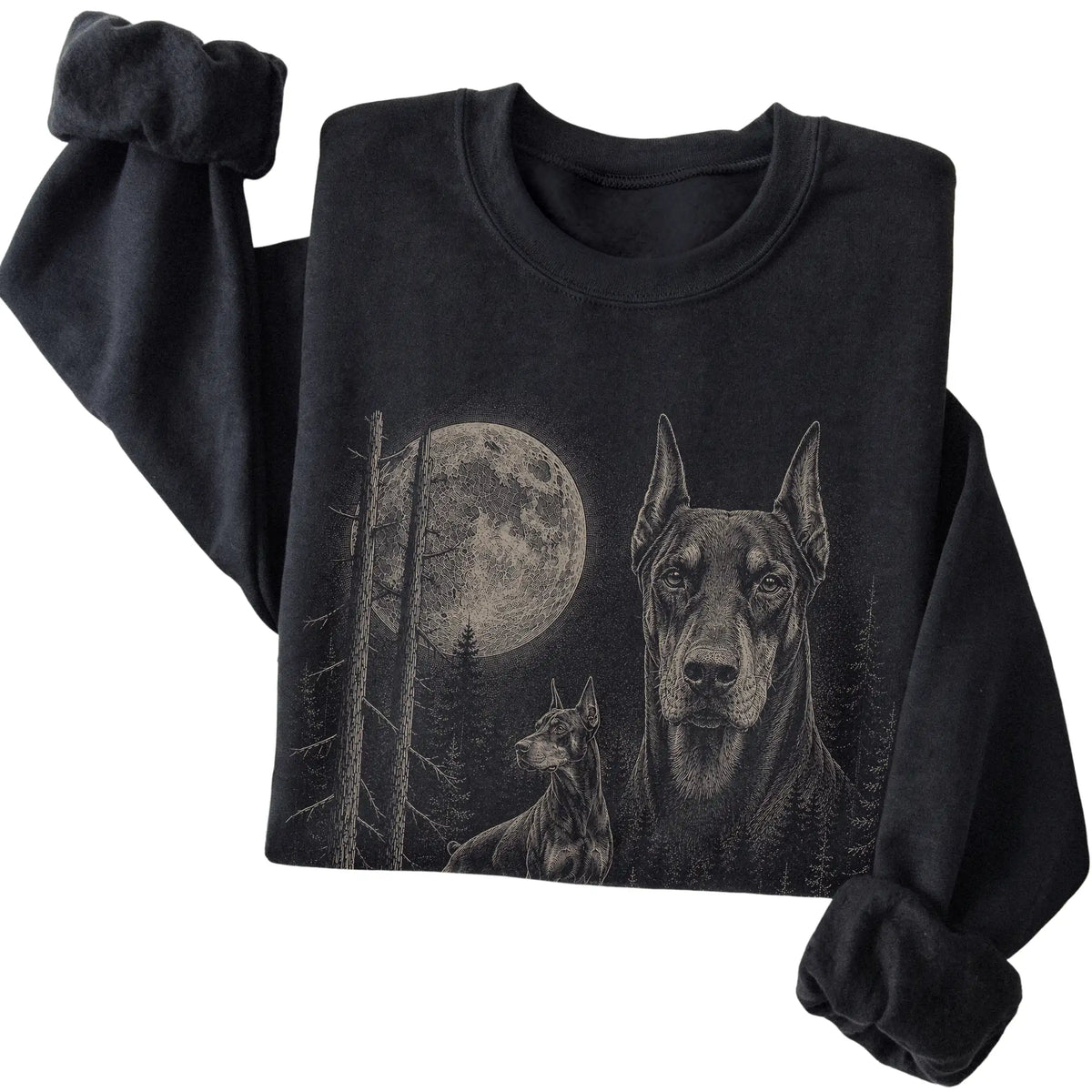 Folded black crewneck sweatshirt showing the Doberman Moonlit Forest graphic
