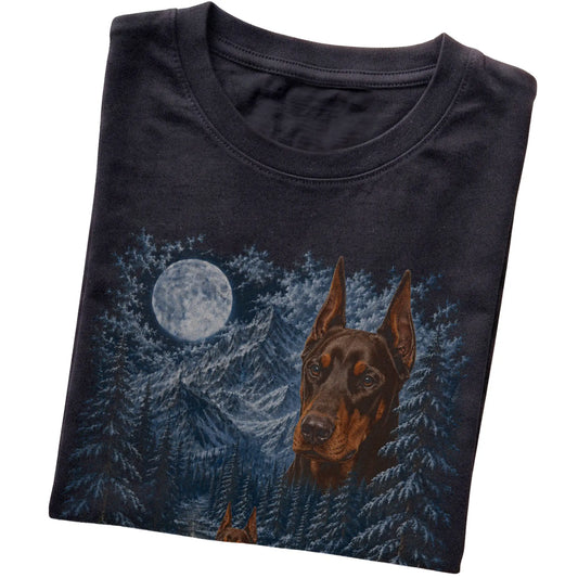 Folded black T-shirt with Doberman Winter Moon artwork.