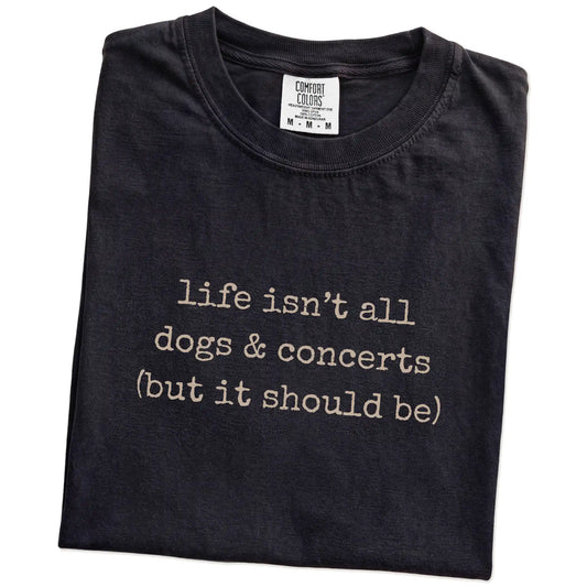 Folded Black Comfort Colors® T-shirt showing dog-themed concerts graphic