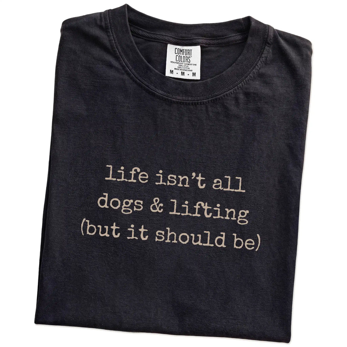 Folded Black Comfort Colors® T-shirt showing dog-themed lifting graphic