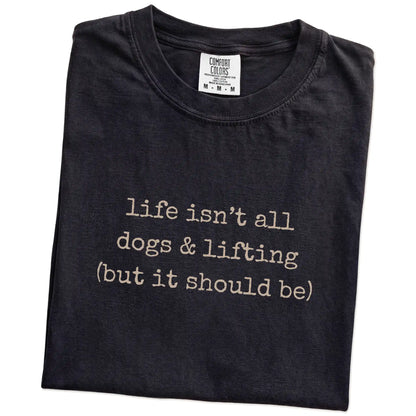 Folded Black Comfort Colors® T-shirt showing dog-themed lifting graphic