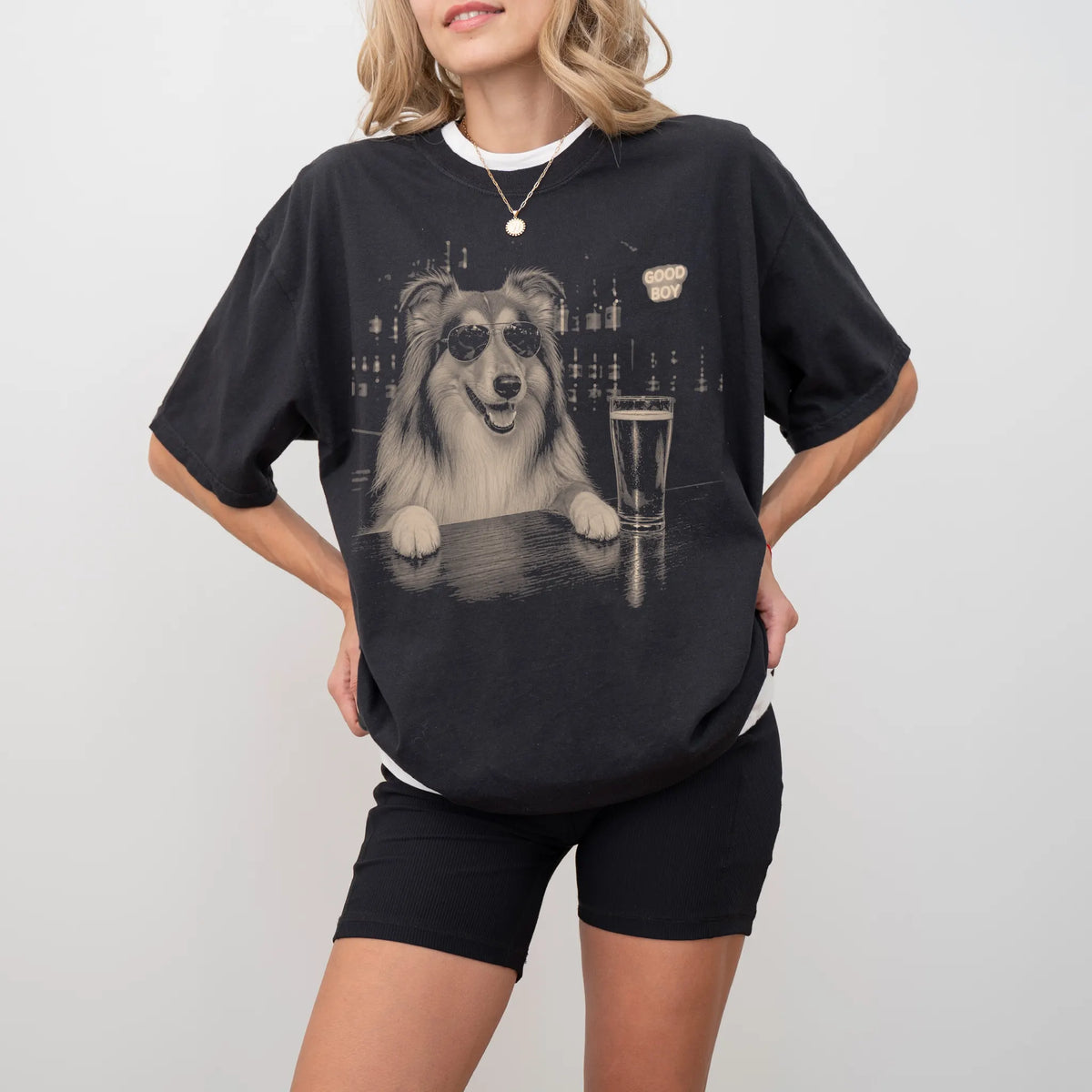 Black Collie at a bar beside a pint, worn in a studio setting