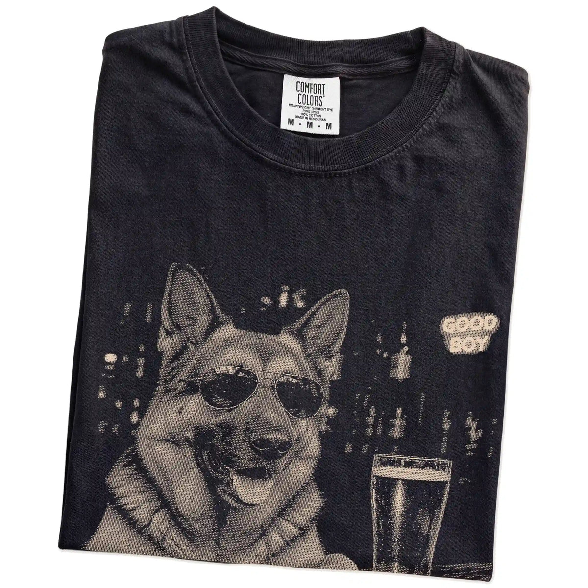 Black German Shepherd at a bar beside a pint, folded detail view