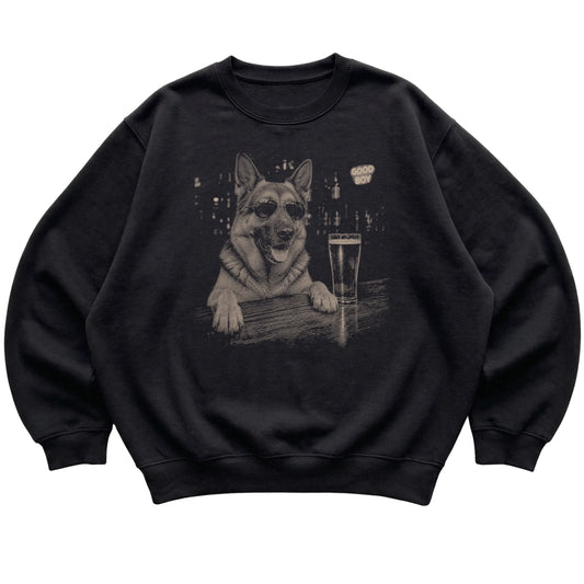 Black German Shepherd at a bar beside a pint, laid flat