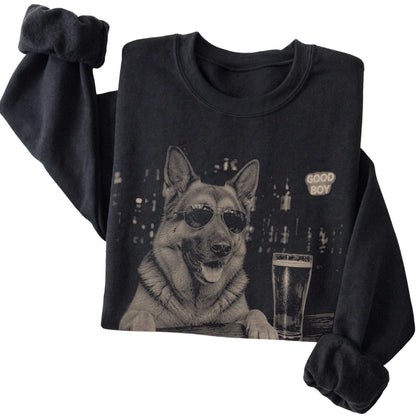 Black German Shepherd at a bar beside a pint, folded detail view