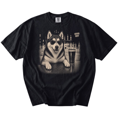 Black Husky at a bar beside a pint, laid flat
