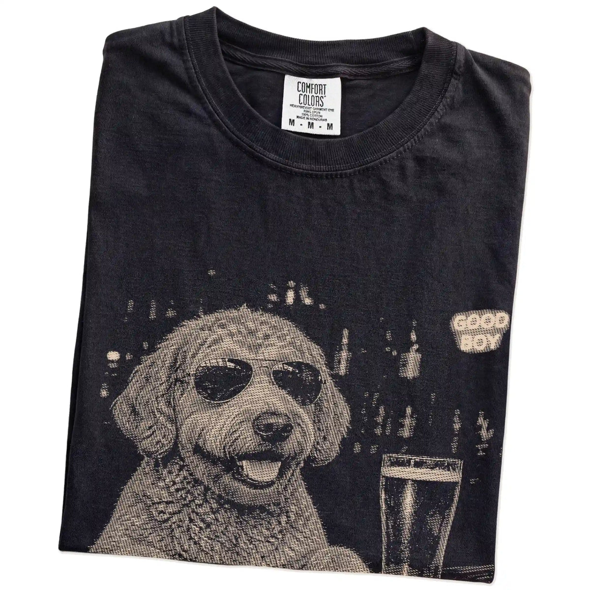 Black Labradoodle at a bar beside a pint, folded detail view