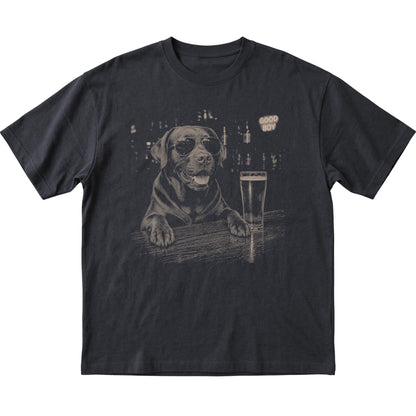 Black Labrador Retriever at a bar beside a pint, laid flat