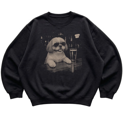 Black Shih Tzu at a bar beside a pint, laid flat