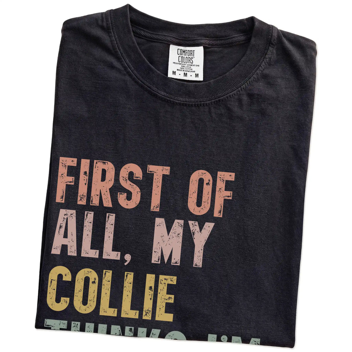 Folded Black Comfort Colors® T-shirt showing “My Collie thinks I’m delightful” text