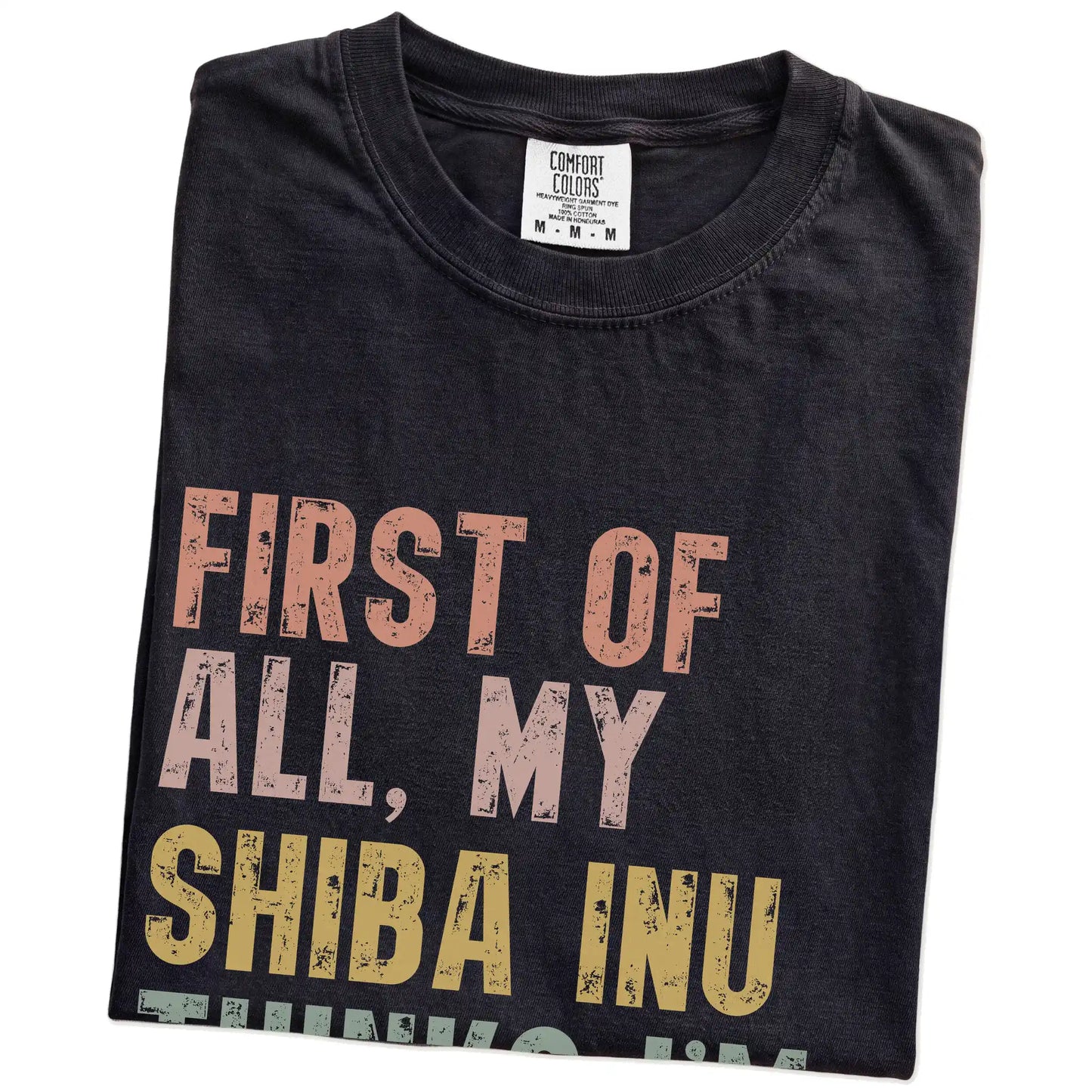 Folded Black Comfort Colors® T-shirt showing “My Shiba Inu thinks I’m delightful” text