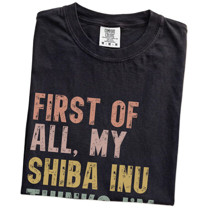 Folded Black Comfort Colors® T-shirt showing “My Shiba Inu thinks I’m delightful” text