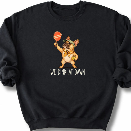 French Bulldog with a pickleball paddle and ball on a Black Gildan® sweatshirt with We Dink at Dawn text