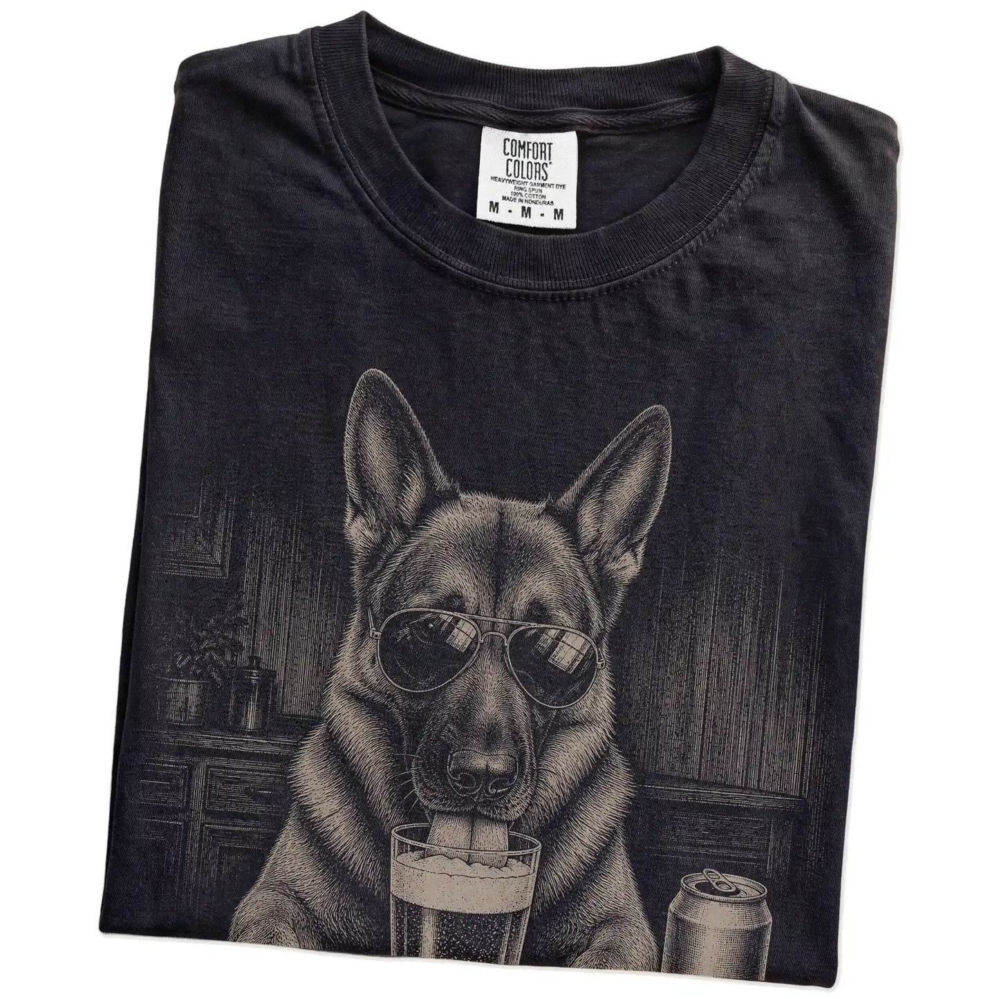 Folded Black Comfort Colors® t-shirt showing German Shepherd sneaking a drink from a pint