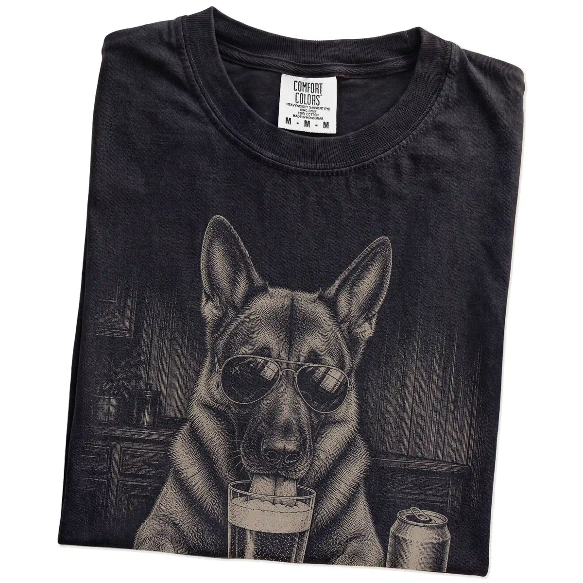 Folded Black Comfort Colors® t-shirt showing German Shepherd sneaking a drink from a pint