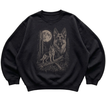 German Shepherd Moonlit Forest graphic on a black crewneck sweatshirt laid flat