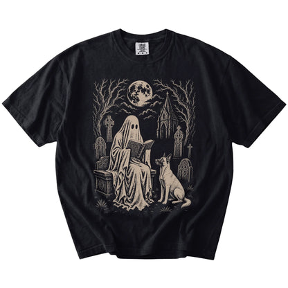 Belgian Malinois beside a reading ghost in a moonlit graveyard on a Black Comfort Colors® T-shirt