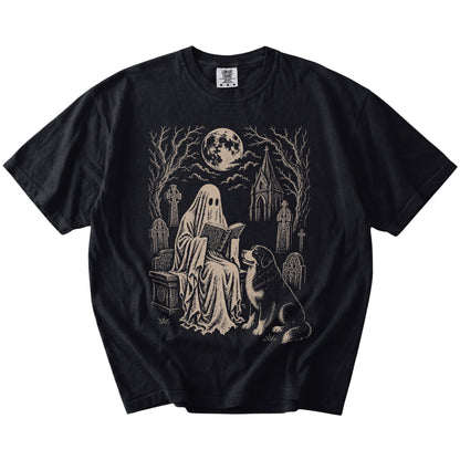 Bernese Mountain Dog beside a reading ghost in a moonlit graveyard on a Black Comfort Colors® T-shirt