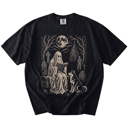 Husky beside a reading ghost in a moonlit graveyard on a Black Comfort Colors® T-shirt