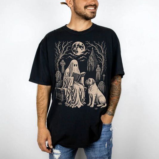 Model wearing a Black Comfort Colors® T-shirt showing Mastiff beside a reading ghost in a moonlit graveyard