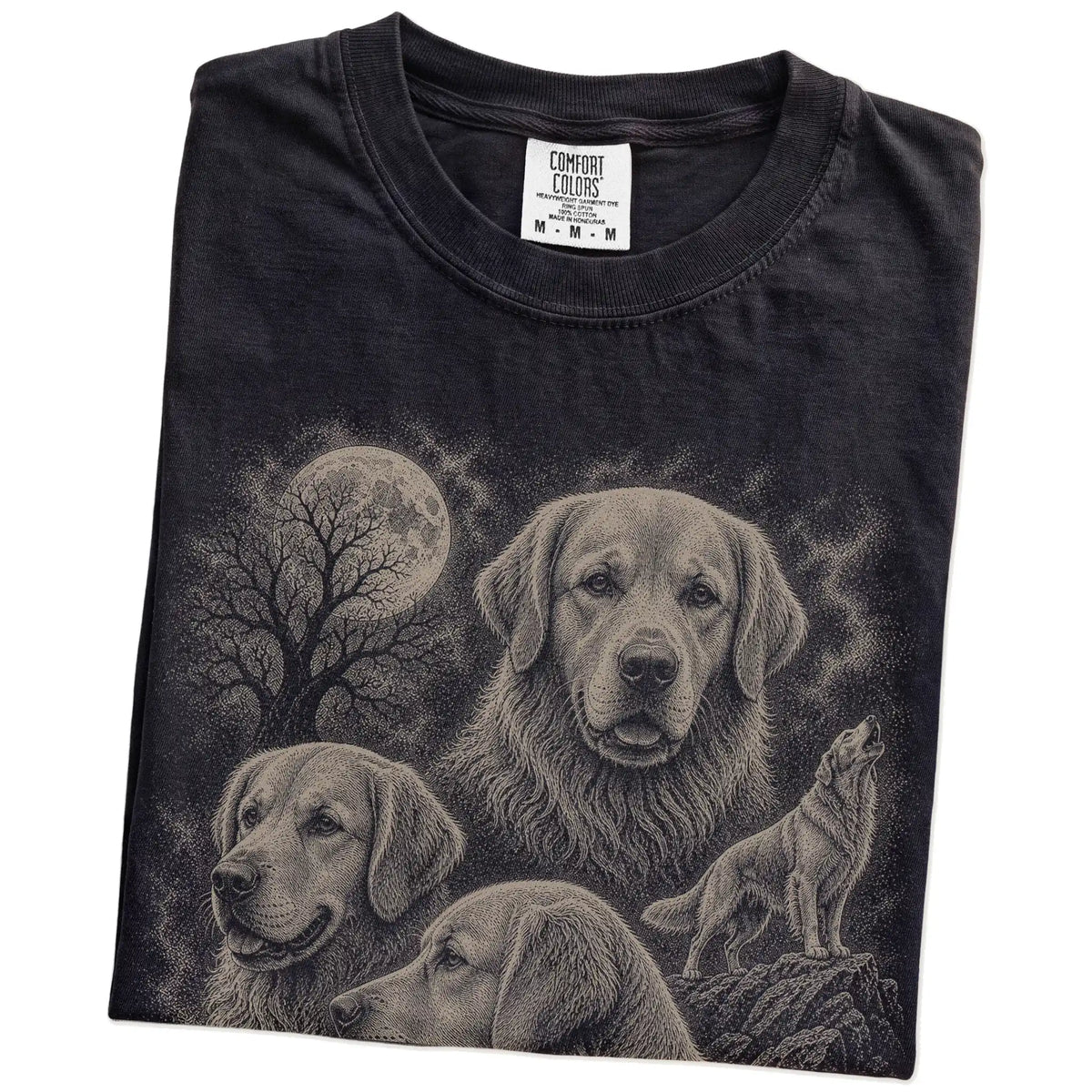 Folded Black Comfort Colors® T-shirt showing a vintage moon montage featuring Golden Retriever