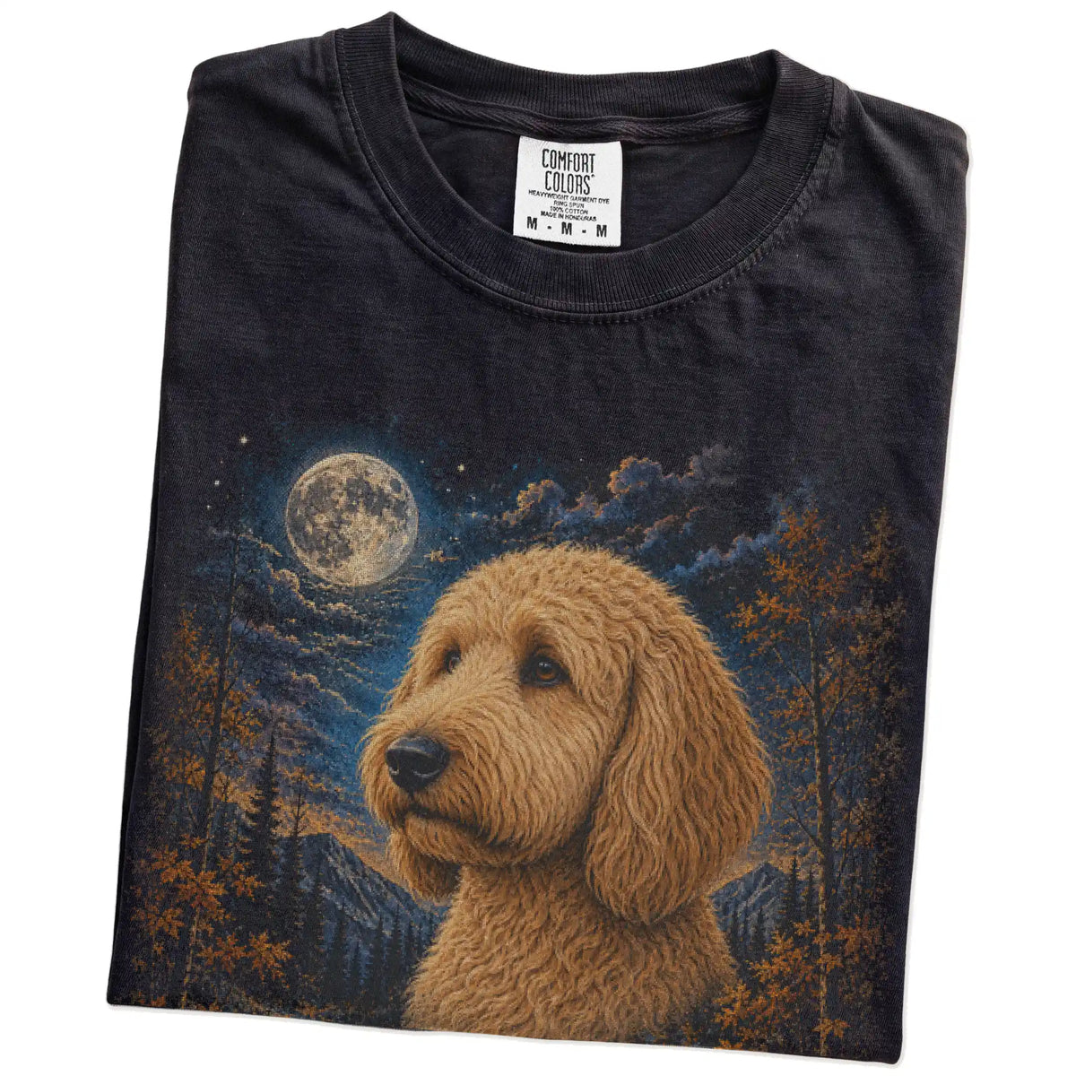 Folded black T-shirt with Goldendoodle Autumn Moon artwork.