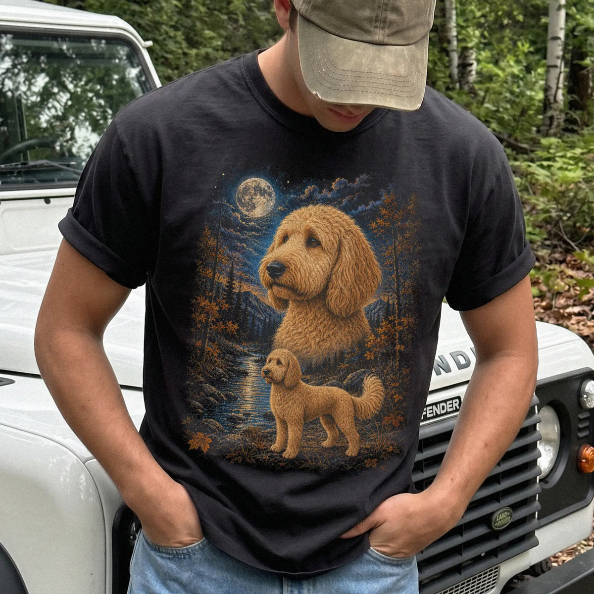 Model wearing a black T-shirt with Goldendoodle Autumn Moon artwork.