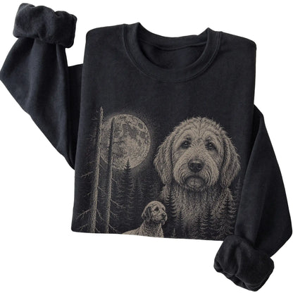 Folded black crewneck sweatshirt showing the Goldendoodle Moonlit Forest graphic
