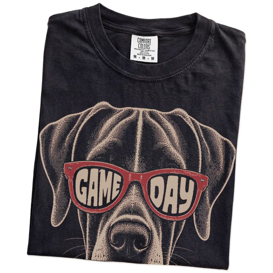 Folded Black Comfort Colors® T-shirt showing great dane wearing red game day sunglasses