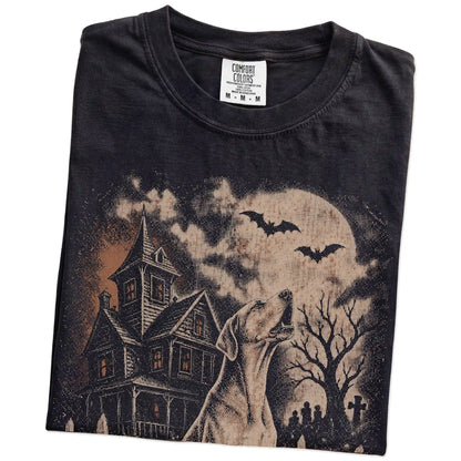 Folded Black Comfort Colors® T-shirt showing Great Dane in a vintage haunted-house scene