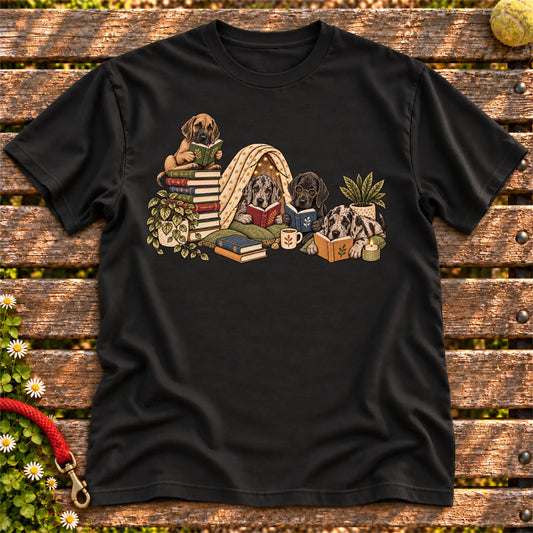 Great Dane puppies reading books in a cozy blanket fort on a Black T-shirt