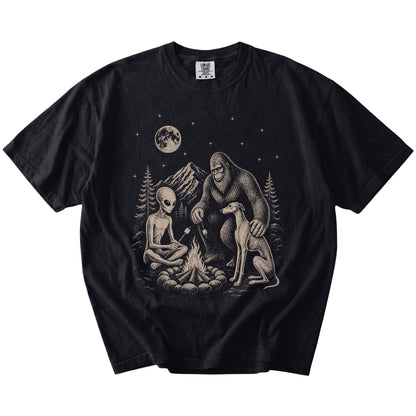 Greyhound camping with Bigfoot and an alien on a Black Comfort Colors® T-shirt