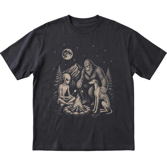 Black Greyhound Camping with Bigfoot and Alien shirt laid flat