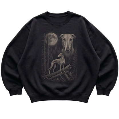 Greyhound Moonlit Forest graphic on a black crewneck sweatshirt laid flat