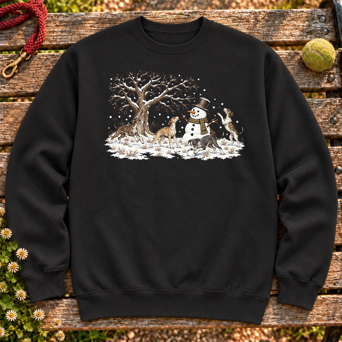 Greyhound puppies playing in snow with a snowman on a Black sweatshirt