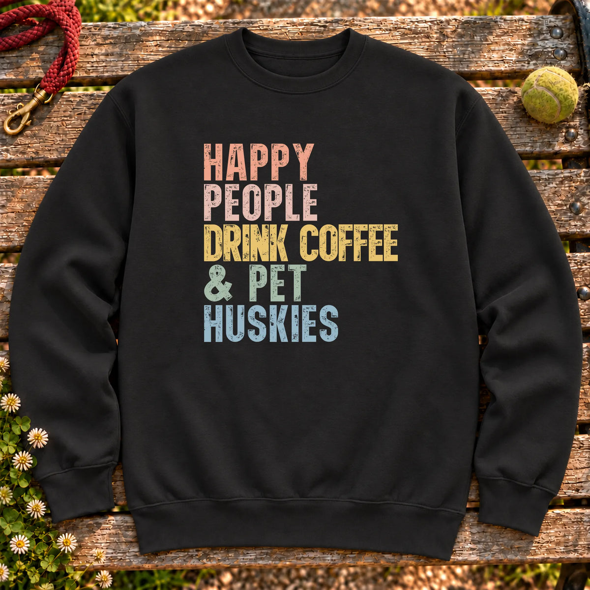 “Happy people drink coffee & pet Huskies” text on a Black sweatshirt