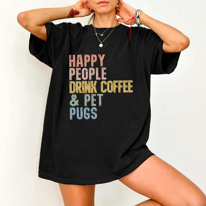 Model wearing a Black Comfort Colors® T-shirt featuring Pug with coffee and “Happy People Drink Coffee and Pet Dogs” letterin