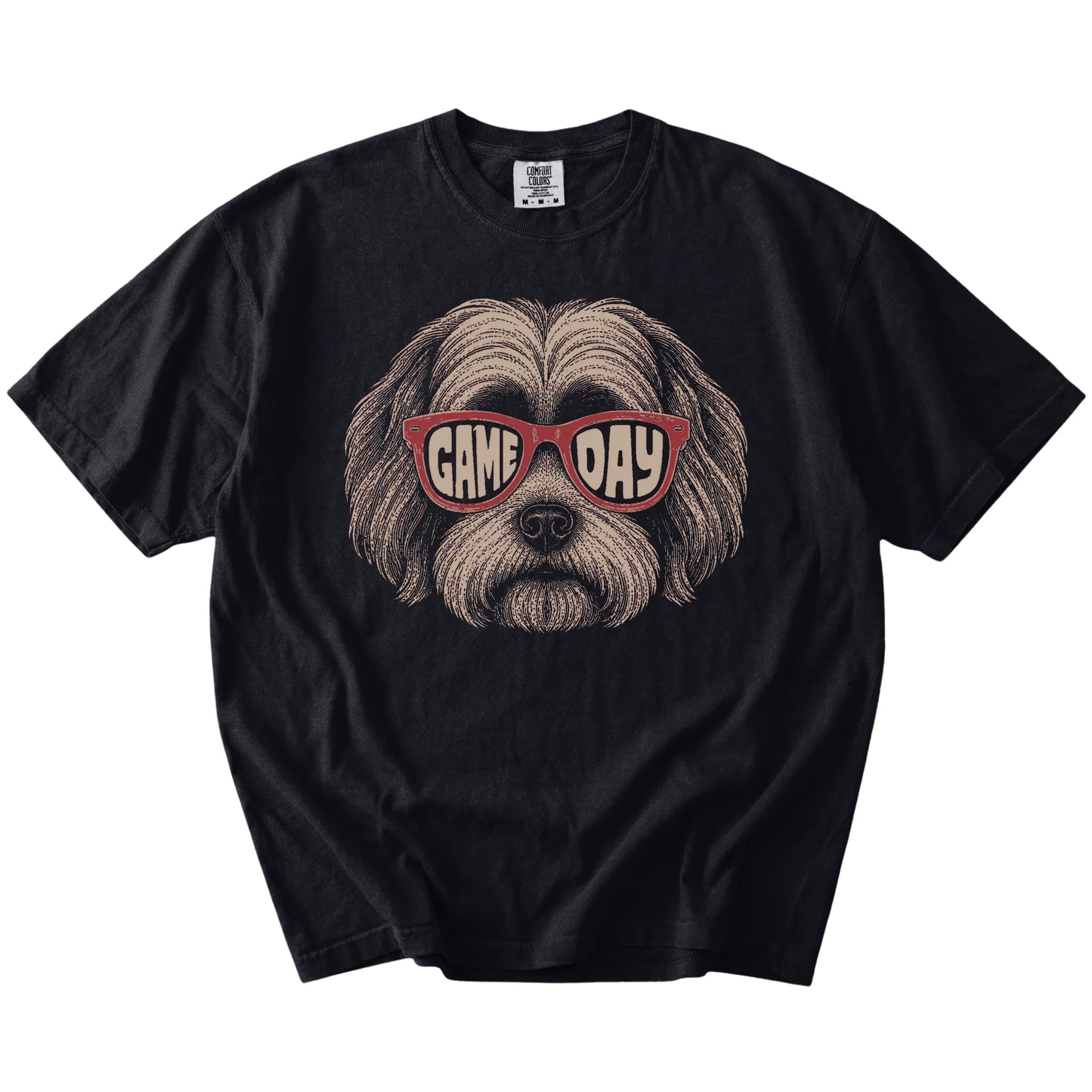 Havanese wearing red Game Day sunglasses on a Black Comfort Colors® T-shirt