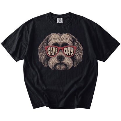 Havanese wearing red Game Day sunglasses on a Black Comfort Colors® T-shirt