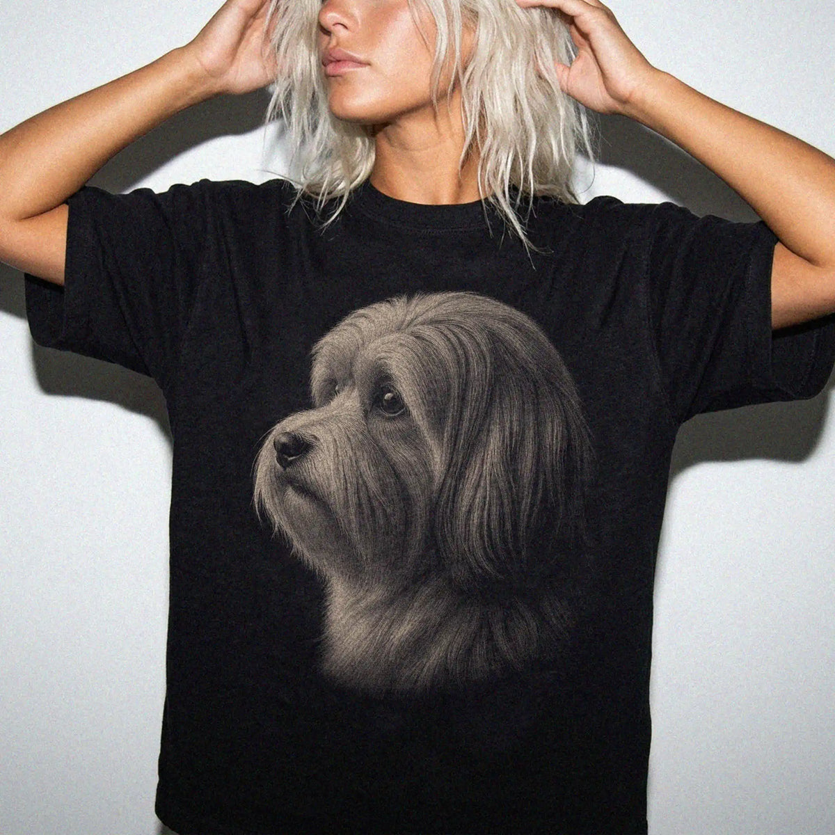 Model wearing a Black Comfort Colors® T-shirt with a detailed photographic portrait of a Havanese