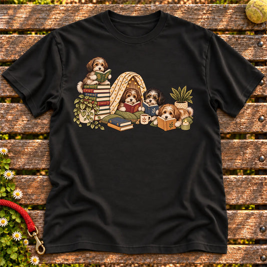 Havanese puppies reading books in a cozy blanket fort on a Black T-shirt