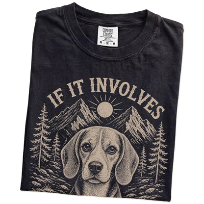 Folded Black Comfort Colors® T-shirt showing Beagle hiking design with mountain scenery
