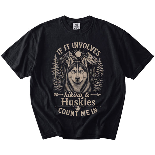 Husky hiking design with mountain scenery on a Black Comfort Colors® T-shirt