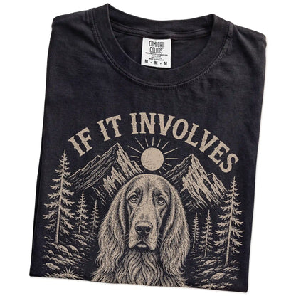 Folded Black Comfort Colors® T-shirt showing Irish Setter hiking design with mountain scenery