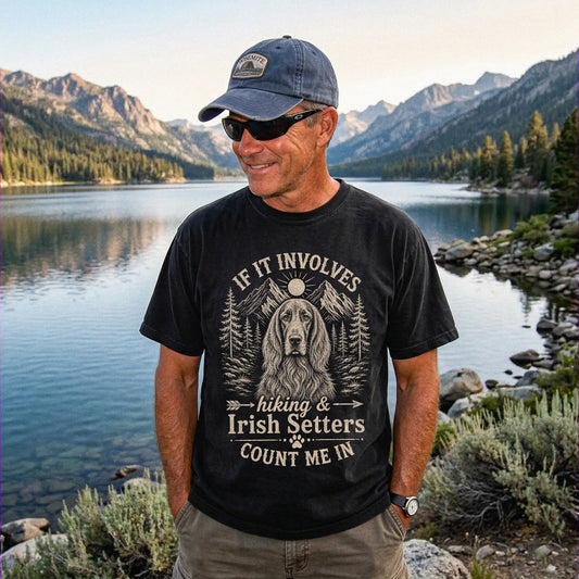 Model wearing a Black Comfort Colors® T-shirt featuring Irish Setter hiking design with mountain scenery