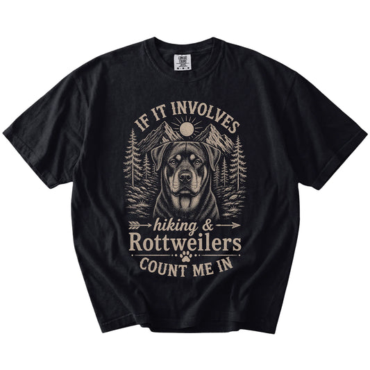 Rottweiler hiking design with mountain scenery on a Black Comfort Colors® T-shirt